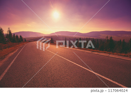 View of the mountain winding highway during sunrise 117064024