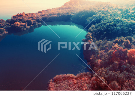 Picturesque mountain lake in autumn. Lake next to the sea. Beautiful wilderness. Aerial view Picturesque mountain lake in autumn. Lake next to the sea. Beautiful wilderness. Aerial view 117066227