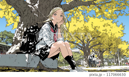 通学路の色づいた銀杏の木の下に腰掛ける女子高生