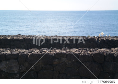 A wall made of basalt from Jeju Island, Korea 117069503