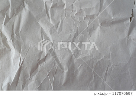 Recycled wrinkled white paper close up texture Recycled wrinkled white paper close up texture 117070697