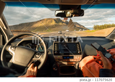 Group tourist driving car on highway among volcanic mountain in summer at Iceland Group tourist driving car on highway among volcanic mountain in summer at Iceland 117075620