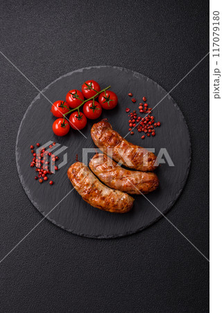Grilled pork or chicken sausages with salt, spices and herbs Grilled pork or chicken sausages with salt, spices and herbs 117079180