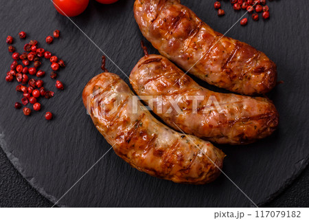 Grilled pork or chicken sausages with salt, spices and herbs Grilled pork or chicken sausages with salt, spices and herbs 117079182