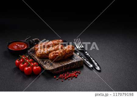 Grilled pork or chicken sausages with salt, spices and herbs Grilled pork or chicken sausages with salt, spices and herbs 117079198