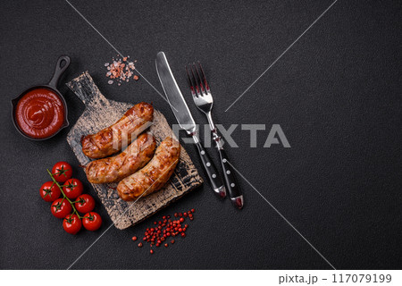 Grilled pork or chicken sausages with salt, spices and herbs Grilled pork or chicken sausages with salt, spices and herbs 117079199