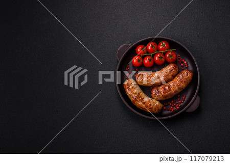 Grilled pork or chicken sausages with salt, spices and herbs Grilled pork or chicken sausages with salt, spices and herbs 117079213