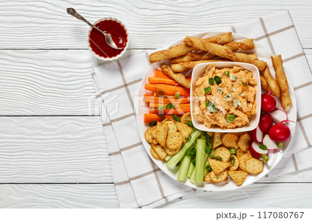 buffalo chicken dip with veggie and bread sticks buffalo chicken dip with veggie and bread sticks 117080767