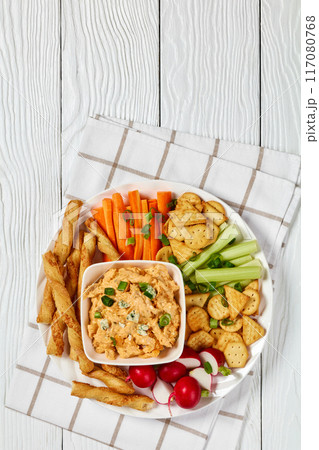 buffalo chicken dip with veggie and bread sticks buffalo chicken dip with veggie and bread sticks 117080768
