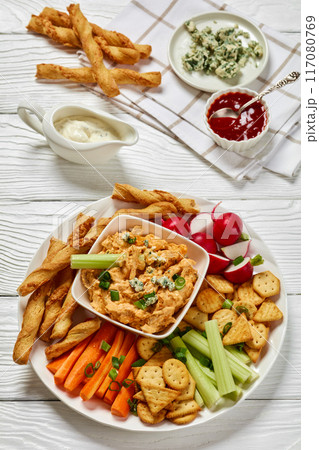 buffalo chicken dip with veggie and bread sticks buffalo chicken dip with veggie and bread sticks 117080769