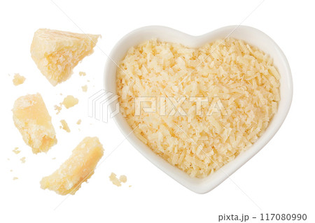 grated parmesan cheese in ceramic bowl isolated on white background. Top view. Flat lay grated parmesan cheese in ceramic bowl isolated on white background. Top view. Flat lay 117080990