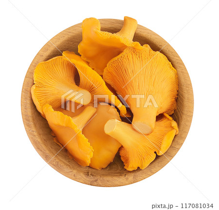 Chanterelle mushroom in wooden bowl isolated on a white background. Top view. Flat lay Chanterelle mushroom in wooden bowl isolated on a white background. Top view. Flat lay 117081034