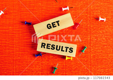 GET RESULTS text written the inscription on the blocks on an orange background 117081543