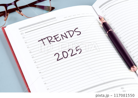 Conceptual trends 2025 symbol. Copy space. Trends 2025 words written in the notebook of a businessman, manager 117081550