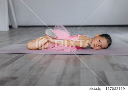 Baby ballet studio. Little ballerina with a coach in dance class. Ballet trainer for children 117082169