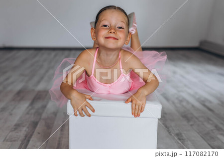 Baby ballet studio. Little ballerina with a coach in dance class. Ballet trainer for children Baby ballet studio. Little ballerina with a coach in dance class. Ballet trainer for children 117082170