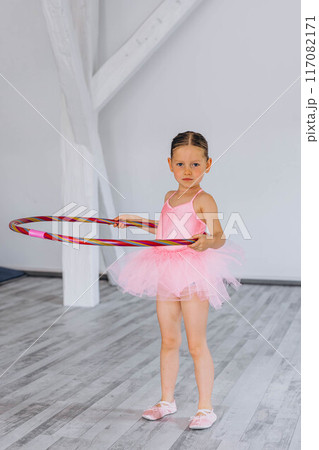 Baby ballet studio. Little ballerina with a coach in dance class. Ballet trainer for children Baby ballet studio. Little ballerina with a coach in dance class. Ballet trainer for children 117082171