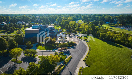Wide aerial Minnetrista Museum and Gardens on bright, sunny summer day with cloudy blue sky Wide aerial Minnetrista Museum and Gardens on bright, sunny summer day with cloudy blue sky 117082503