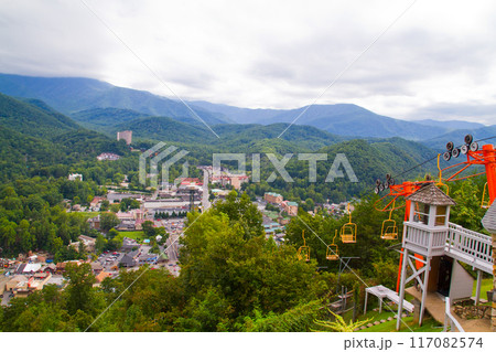 Overcast View of Vibrant Mountain Town with Chairlift Overcast View of Vibrant Mountain Town with Chairlift 117082574