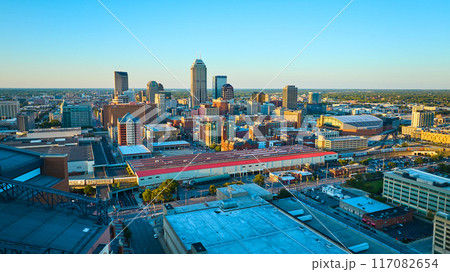 Aerial Golden Hour Cityscape with Stadium and Skyscrapers 117082654