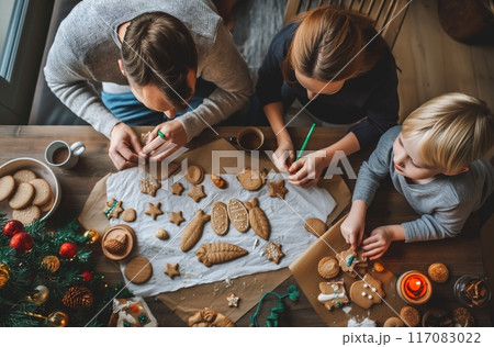 Family decorating homemade Christmas cookies Family decorating homemade Christmas cookies 117083022