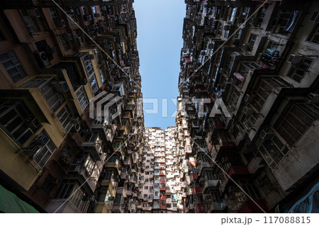 Yick Fat Building, Quarry Bay, Hong Kong. Residential area in old apartment with windows. High-rise building, skyscraper with windows of architecture in urban city. Yick Fat Building, Quarry Bay, Hong Kong. Residential area in old apartment with windows. High-rise building, skyscraper with windows of architecture in urban city. 117088815