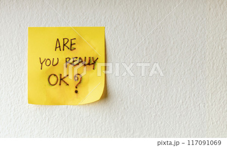 Mind, Mental Health and Encouragement Concepts. a Sticky Note with the Meaning of Care was taped on the white Wall Mind, Mental Health and Encouragement Concepts. a Sticky Note with the Meaning of Care was taped on the white Wall 117091069