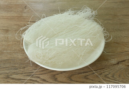 dry instant vermicelli thin noodles raw food arranging on plate 117095706
