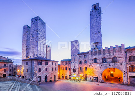 San Gimignano, Tuscany - Italy. Picturesque morning view of famous Piazza del Duomo and medieval towers. 117095835