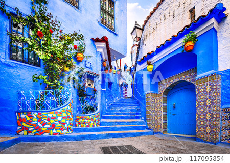 Chefchaouen, Morocco. Blue medina, ancient city, staircase and wall decorated with colourful flowerpots. 117095854