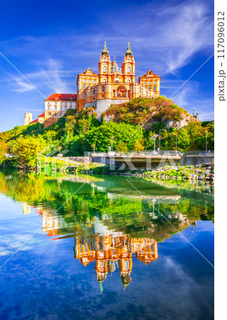 Melk Abbey, Austria. Stift Melk reflected in the water of Danube River, scenic Wachau Valley. 117096012