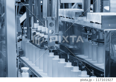 The  empty healthcare  bottles  on the conveyor belt for filling process. 117101927