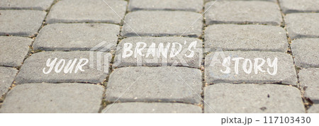 Branding and your brand story symbol. Concept words Your brands story on beautiful grey paving slabs. Beautiful grey paving slabs background. Business branding your brand story concept. Copy space. Branding and your brand story symbol. Concept words Your brands story on beautiful grey paving slabs. Beautiful grey paving slabs background. Business branding your brand story concept. Copy space. 117103430