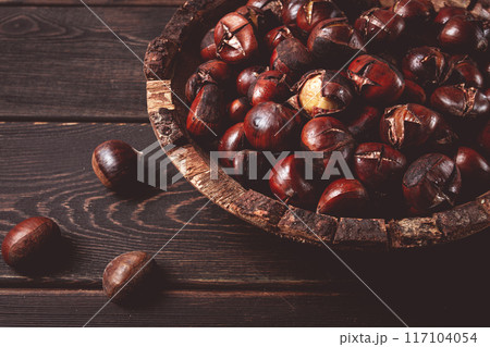roasted chestnuts, in a wooden plate, top view, homemade, no people, roasted chestnuts, in a wooden plate, top view, homemade, no people, 117104054