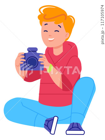 Laughing boy with photo camera shooting pictures 117105974