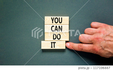 You can do it symbol. Concept word You can do it on beautiful wooden block. Beautiful grey table grey background. Businessman hand. Business motivational you can do it concept. Copy space. 117106887