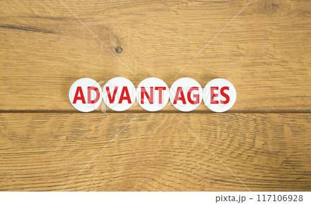 Advantages symbol. Concept word Advantages on beautiful white pill. Beautiful wooden background. Business advantages concept. Copy space. 117106928