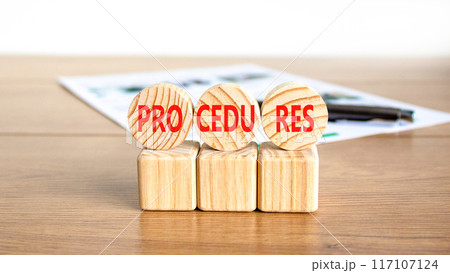 Procedures symbol. Concept word Procedures on beautiful wooden circles. Beautiful wooden table white background. Black pen. White document. Business procedures concept. Copy space. 117107124