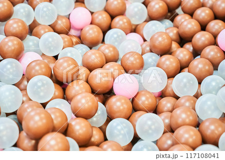 Close-up of colored plastic balls in the pool of the playroom. With space to copy. High quality photo 117108041