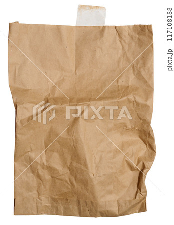 A large empty brown kraft paper bag for packaging products in stores on an isolated background 117108188