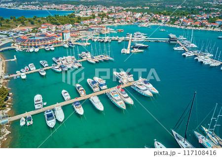 Luxury yachts and sailboats are docking in marina Frapa in Rogoznica town, Croatia on sunny summer day. Touristic city for summer vacation in Adriatic sea, Dalmatia region. Summer vacation concept Luxury yachts and sailboats are docking in marina Frapa in Rogoznica town, Croatia on sunny summer day. Touristic city for summer vacation in Adriatic sea, Dalmatia region. Summer vacation concept 117108416