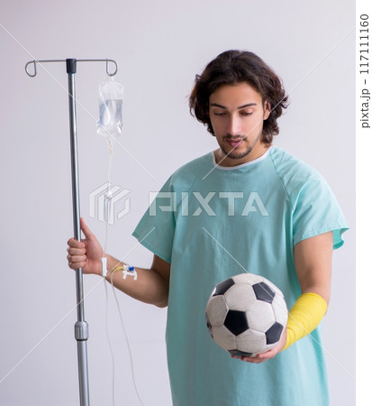 Young man staying in hospital in transfusion concept Young man staying in hospital in transfusion concept 117111160