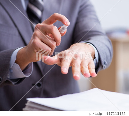 Young male employee in self-quarantine concept 117113183