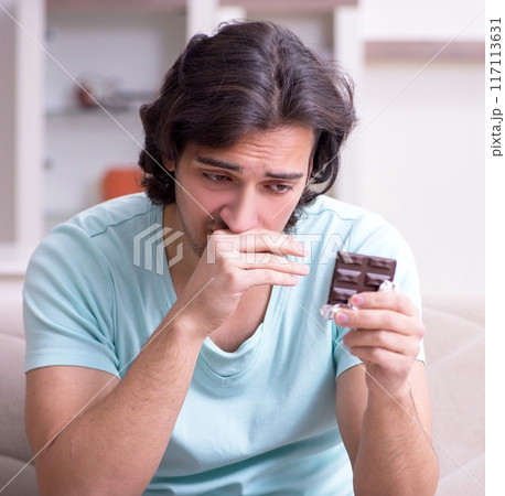 Young man suffering from allergy 117113631