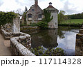 Scotney Castle in Kent England with moat and surrounded by farmland 117114328