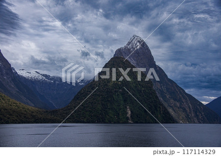 Mitre Peak as seen from the shore of Milford Sound in New Zealand 117114329