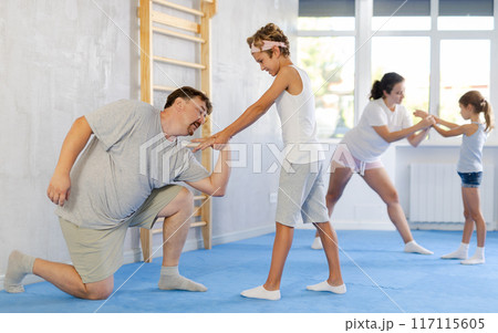 Father and son training self-defense techniques Father and son training self-defense techniques 117115605