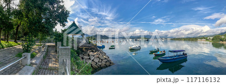 Paanorama of natural outdoor background, blue sky, clouds, mountains, fishing boats with Paanorama of natural outdoor background, blue sky, clouds, mountains, fishing boats with 117116132