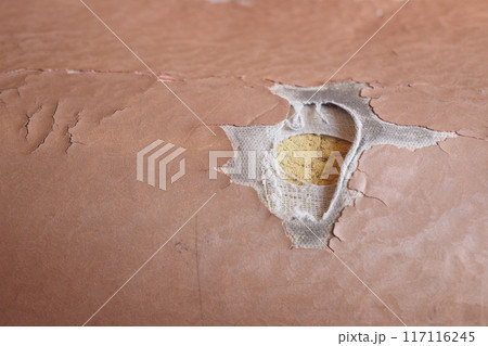 damage Leather with a cracked texture on a sofa . 117116245