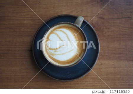 Coffee cup on wood table Coffee cup on wood table 117116529